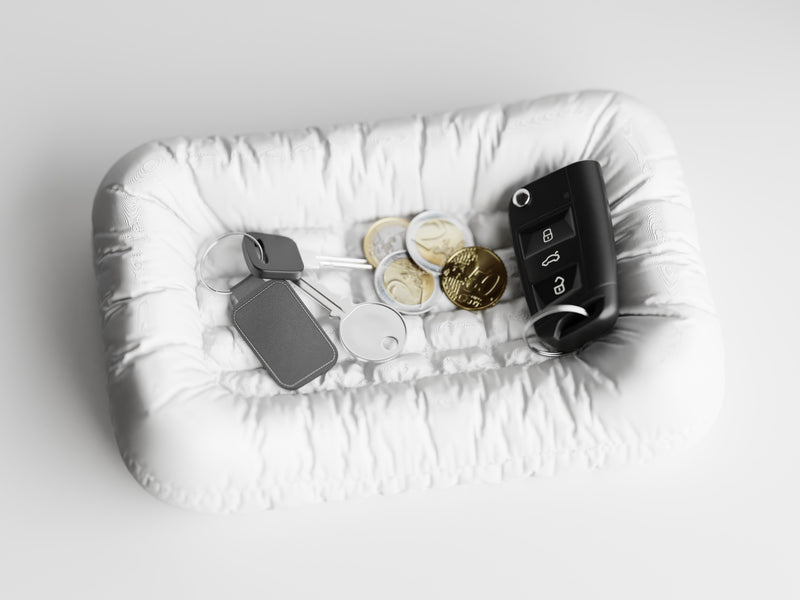 White Key Couch tray for holding your keys. 